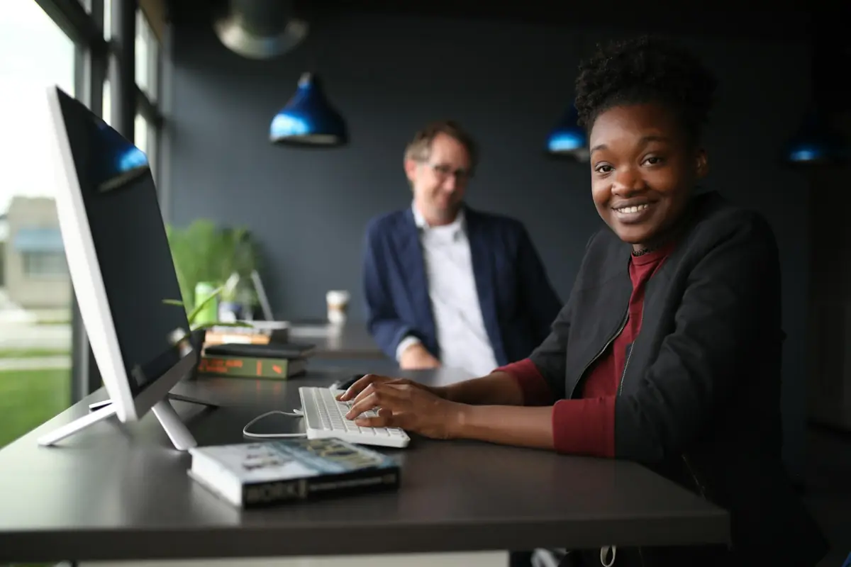 Professionals collaborating over documents at a desk